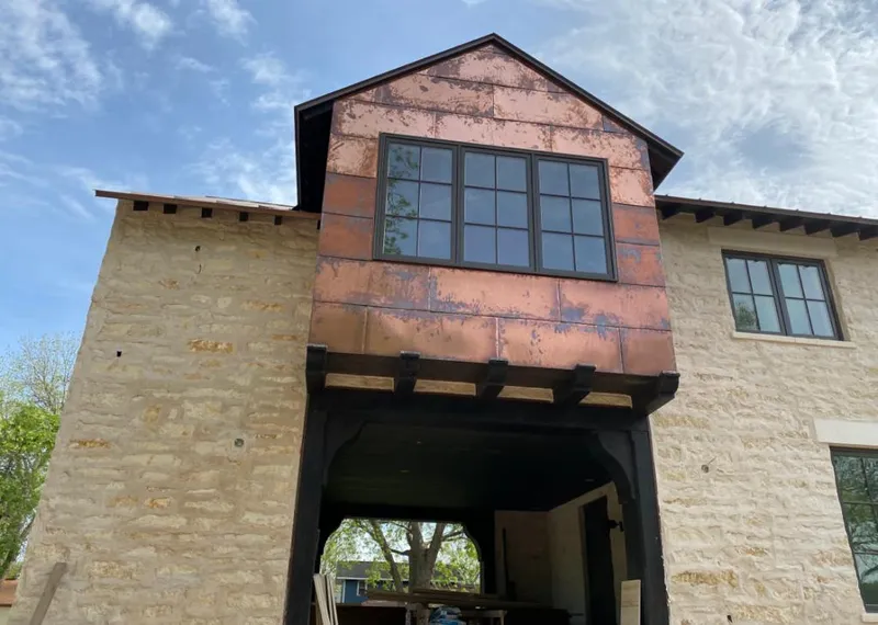 Copper metal panel facade on a stone building for Skylight Installation in Vinings