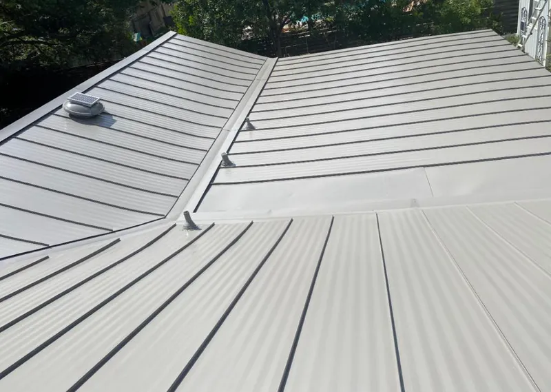 Solar attic fan installed on a metal roof for Roof Ventilation in Vinings